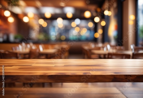 Empty wood table top on abstract blurred restaurant background