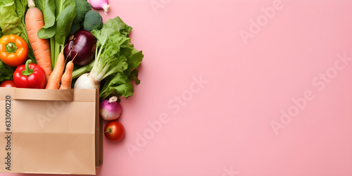 Delivery healthy vegetables organic food. Vegan vegetarian food in paper bag vegetables on pink background. Fresh vegetables food grocery shopping or buy on supermarket and clean eating, copy space.