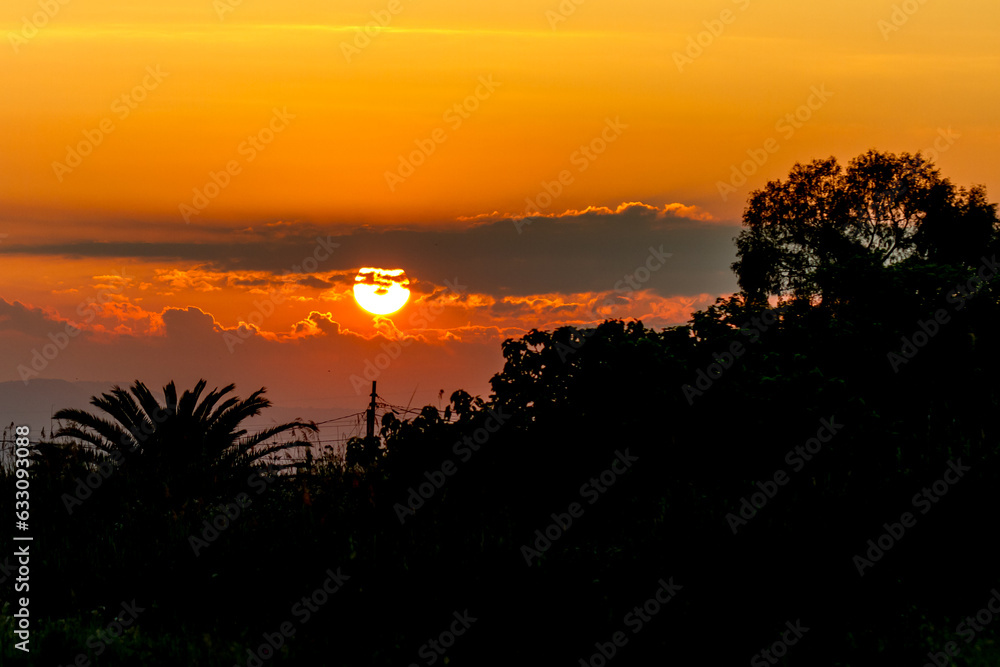 Obraz premium Sunset over tropical landscape
