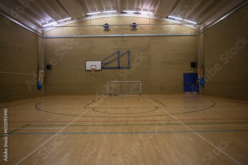 Sports gymnasium with basketball hoop court and soccer net  photo