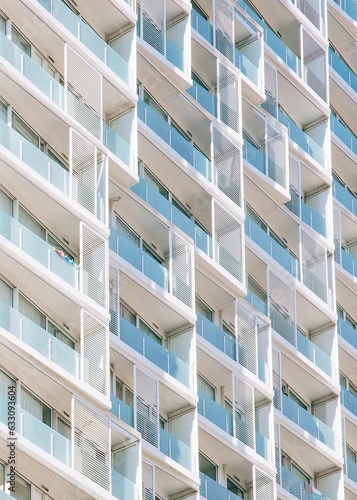 white and glass Building exterior with balconies and windows 