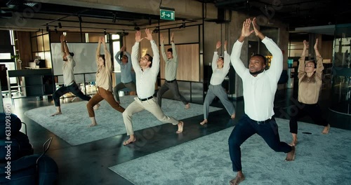 The international team does yoga during the break between work in the office. Oyise workers keep their body and mind in fine photo