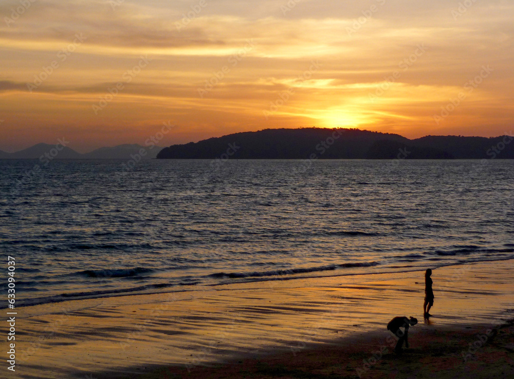 Beach promenade at Ao Nang Bay against sunset 