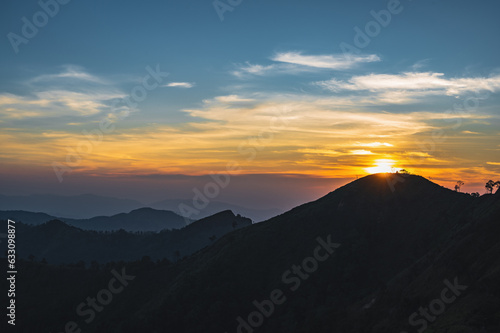 Beautiful Sunset view and layers mountains on khao khao chang phueak mountian.Thong Pha Phum National Park's highest mountain is known as Khao Chang Phueak © Sumeth