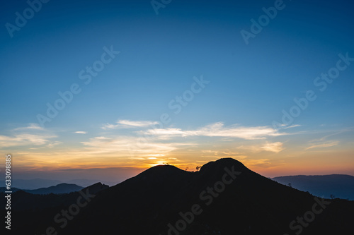 Beautiful Sunset view and layers mountains on khao khao chang phueak mountian.Thong Pha Phum National Park's highest mountain is known as Khao Chang Phueak