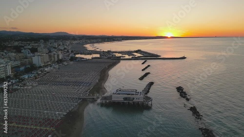 4k aerial footage of the beautiful Gabicce Mare at sunset with the entire Romagna Riviera from Cattolica, Misano, Riccione to Rimini