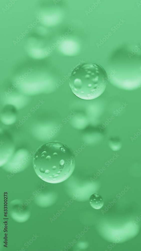 Vertical close up rising up bubbles green color on green background Vertical close up rising up bubbles green color on green background