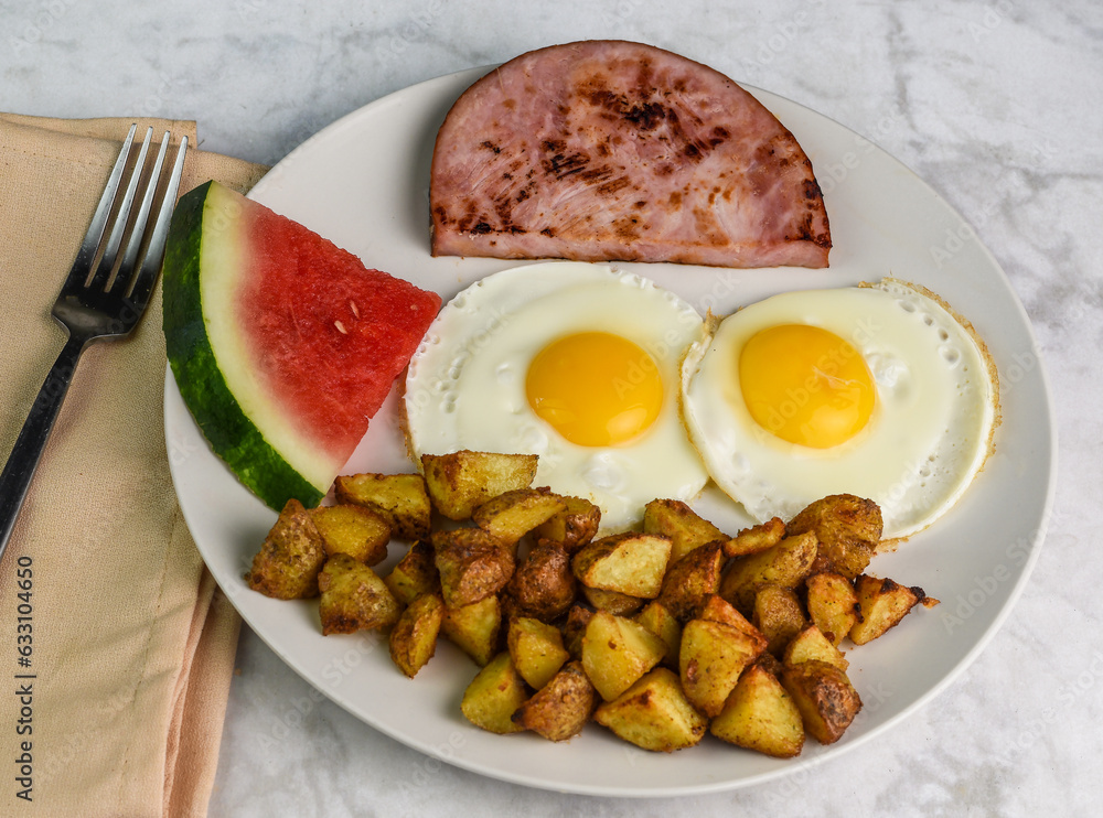 fried eggs with ham homefries and water melon fried eggs with ham homefries and water melon