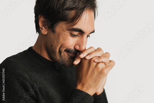 man praying with joined hands