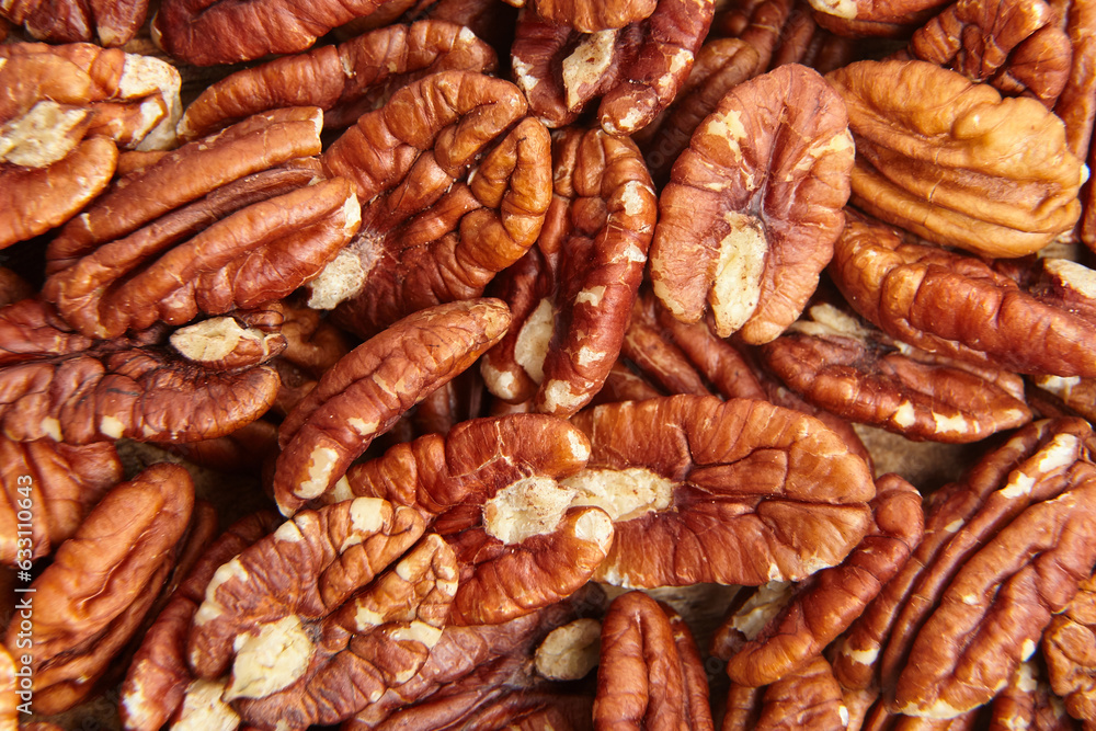 Pecan nuts kernel texture background closeup. Heap of peeled pecan halves. A rich harvest of peeled pecan nuts Pecan nuts kernel texture background closeup. Heap of peeled pecan halves. A rich harvest of peeled pecan nuts