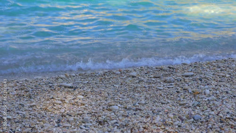 Rough sand beach, sea water washes over, closeup detail - abstract shallow depth of field tropical vacation background