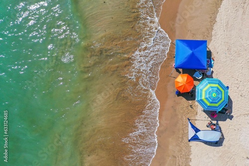 Aerial view of beach umbrellas for the sun Aerial shot, of Bahia de Kino, Sonora Mexico. real estate
