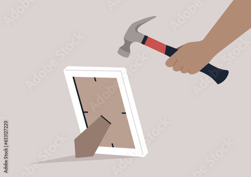 A hand shatters a photo frame containing painful memories, using a hammer to forcefully break it, symbolizing the release from emotional distress