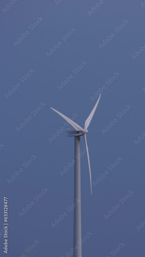 Vertical video. Wind turbines against the background of the evening sky. Vertical video. Wind turbines against the background of the evening sky.