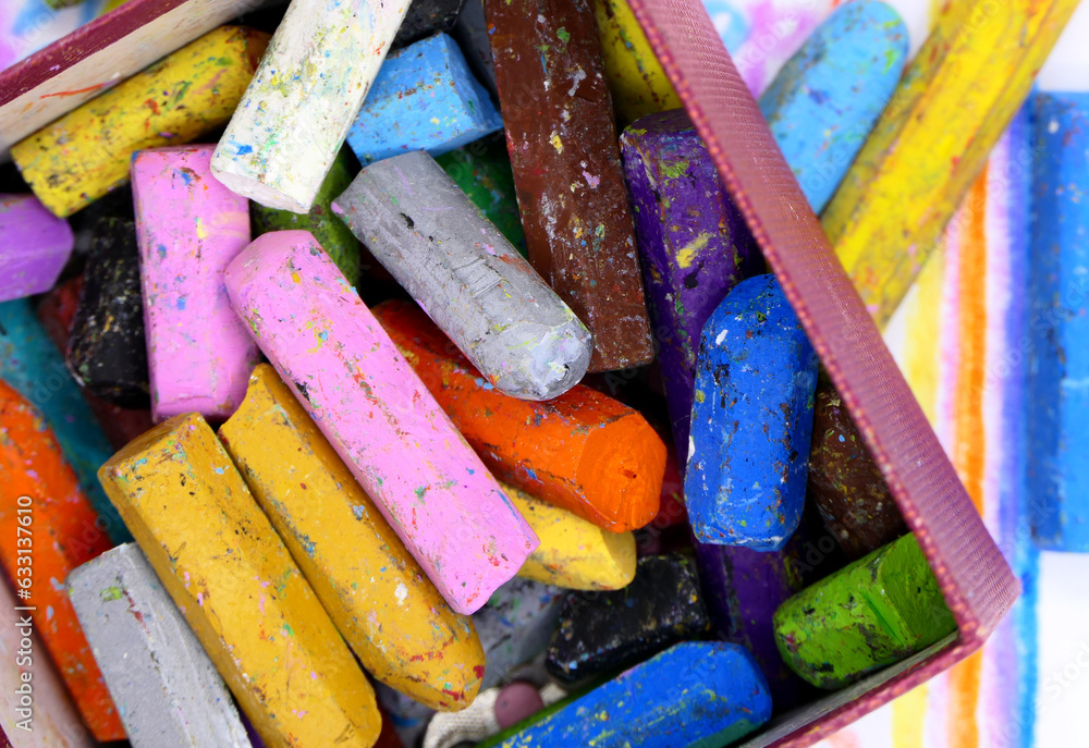 colorful crayons on a paper background colorful crayons on a paper background
