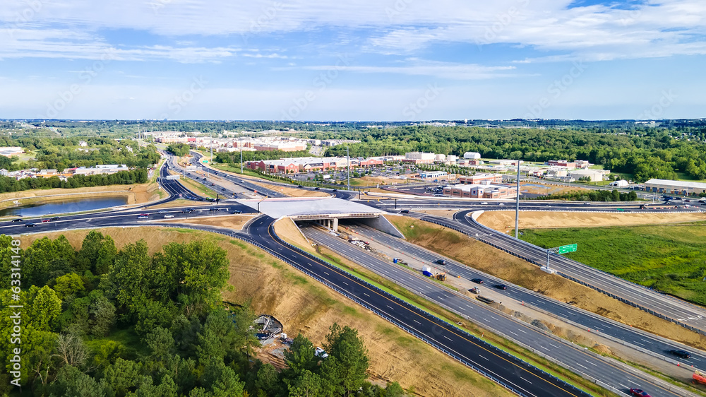road interchange and parking lot in Leesburg, Virginia. View from a drone on a sunny day.