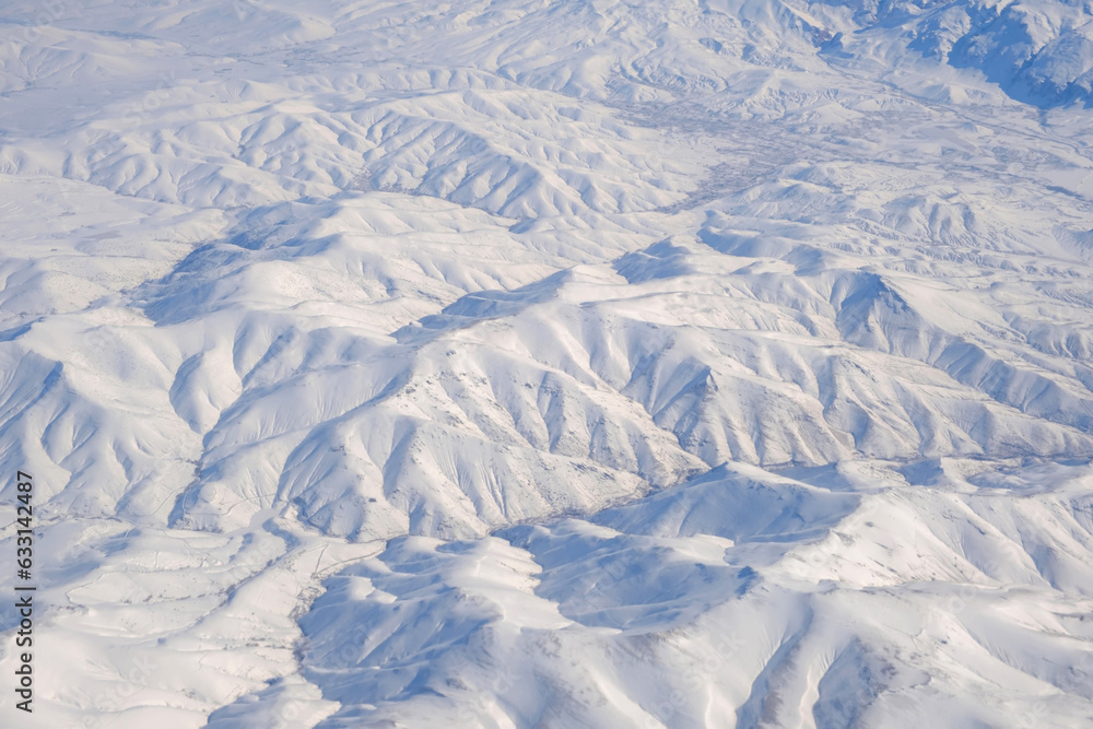 Fototapeta premium Aerial view of snow-capped Taurus mountains in Turkey