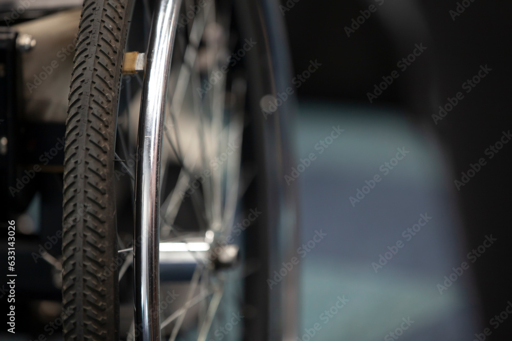 Wheelchair wheel, close-up, copyspace. The concept of inclusion.