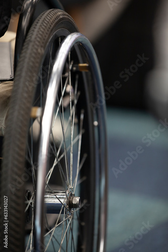 Obraz na płótnie Wheelchair wheel, close-up, copyspace. The concept of inclusion. w salonie