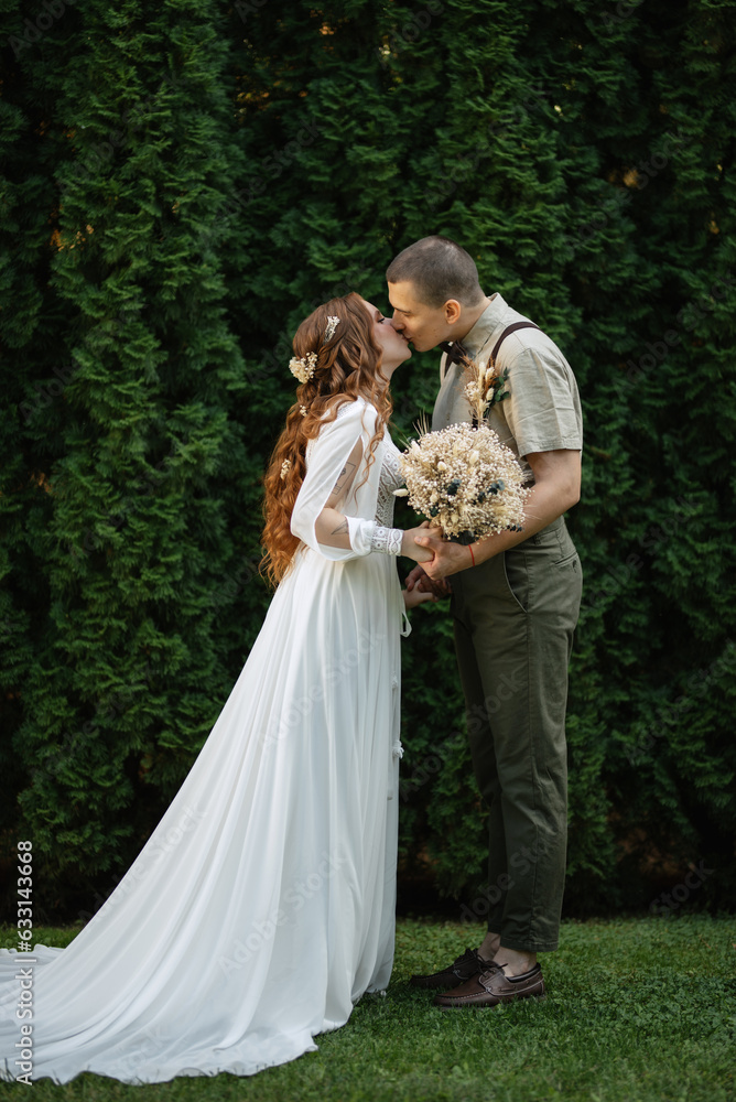 wedding walk of the bride and groom in a coniferous wedding walk of the bride and groom in a coniferous