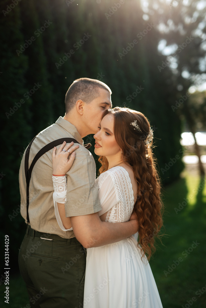 wedding walk of the bride and groom in a coniferous wedding walk of the bride and groom in a coniferous