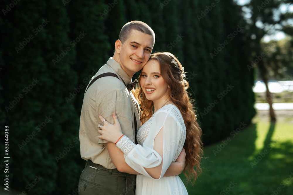 Fototapeta premium wedding walk of the bride and groom in a coniferous