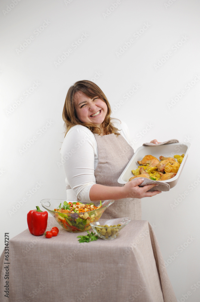 Smiling young woman serving fresh salad on plate. Happy smiling cute woman cooking fresh healthy vegan salad at home with many vegetables in kitchen and trying new recipe High quality photo Smiling young woman serving fresh salad on plate. Happy smiling cute woman cooking fresh healthy vegan salad at home with many vegetables in kitchen and trying new recipe High quality photo