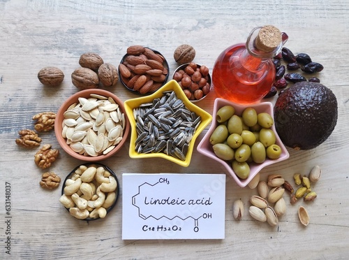 Food high in linoleic acid with structural chemical formula of linoleic acid. Natural food sources of omega 6 and omega 3 essential fatty acids. Good fats - nuts, seeds, oils; concept of healthy diet.
