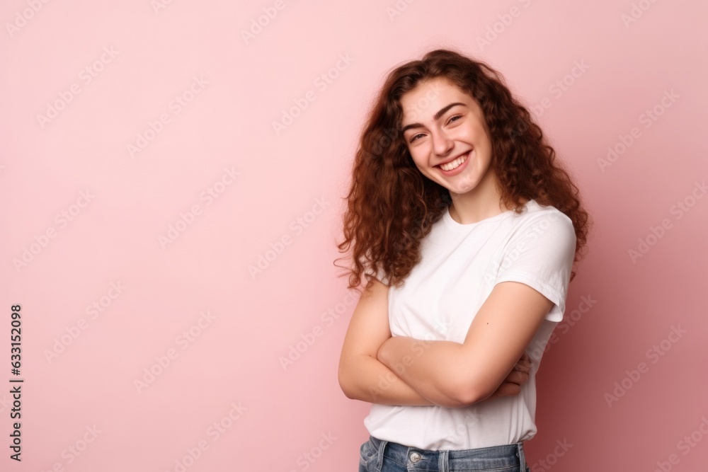 Young beautiful girl in a white T-shirt on a pink background Young beautiful girl in a white T-shirt on a pink background