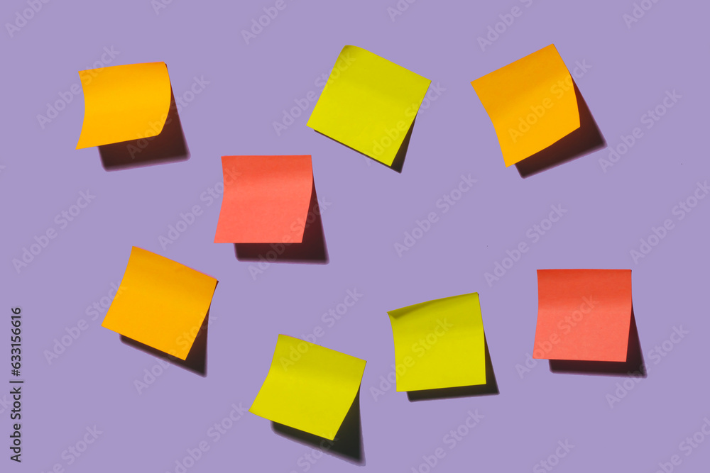 Empty colorful sticky notes on purple background Empty colorful sticky notes on purple background