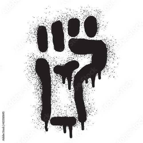 Raised fist stencil graffiti with black spray paint	