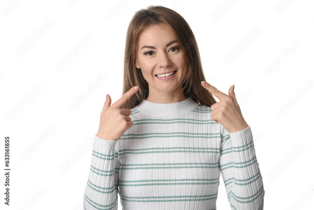 Beautiful woman in striped shirt pointing at her smile on white background Beautiful woman in striped shirt pointing at her smile on white background