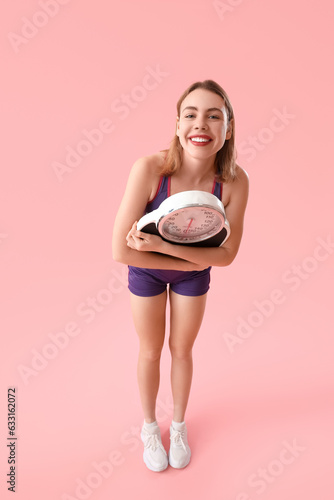 Happy young woman with scal...