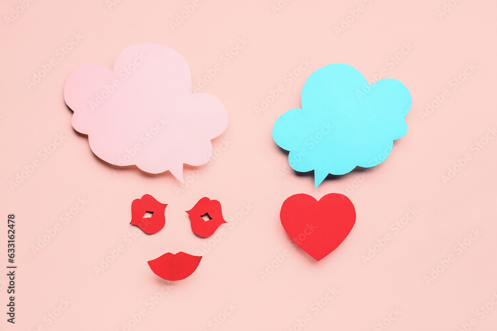 Paper lips and and heart with blank speech bubbles on pink background Paper lips and and heart with blank speech bubbles on pink background