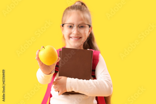 Smiling schoolgirl with gla...