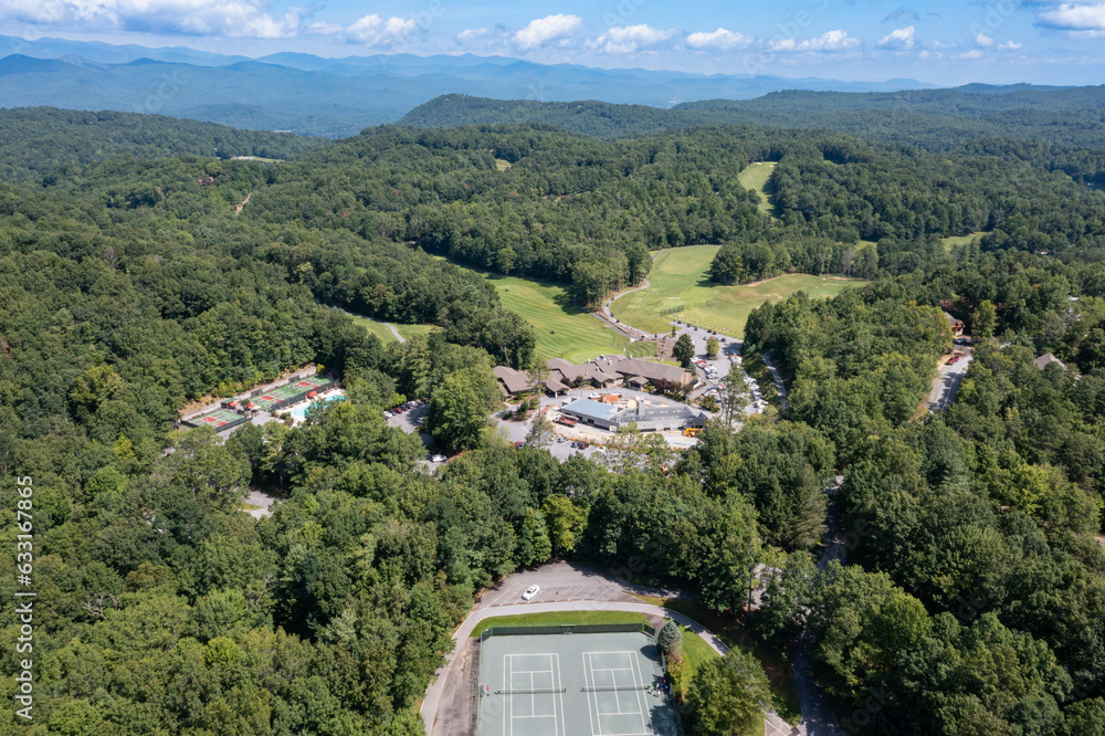 drone views of golf course club house amenities lake