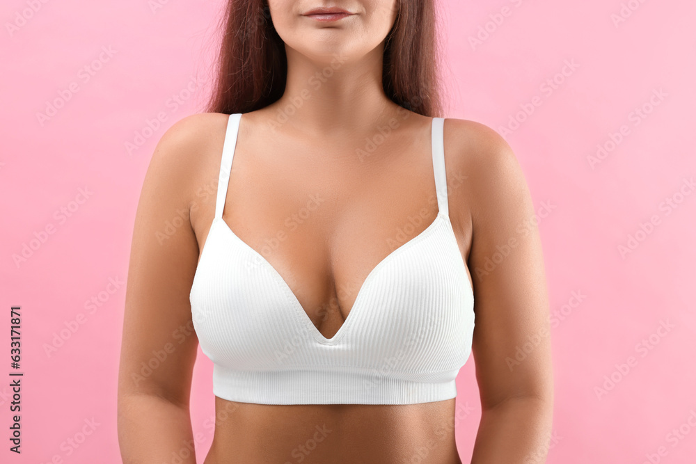 Fototapeta premium Woman with beautiful breast on pink background, closeup
