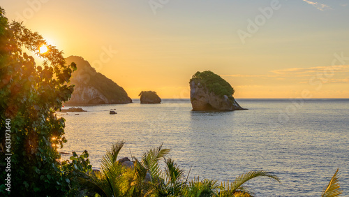 Fototapeta Naklejka Na Ścianę i Meble -  Puerto Vallarta's Los Arcos iconic islands at golden hour