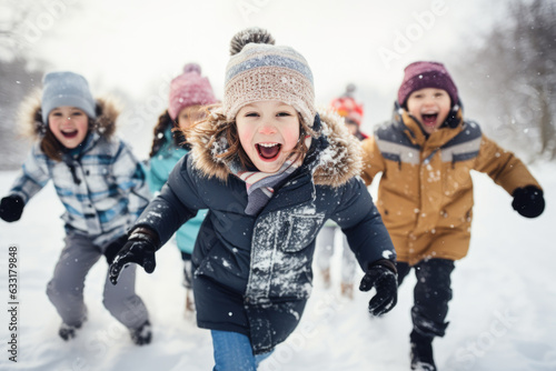 A group of children playing in the snow, laughing and having fun