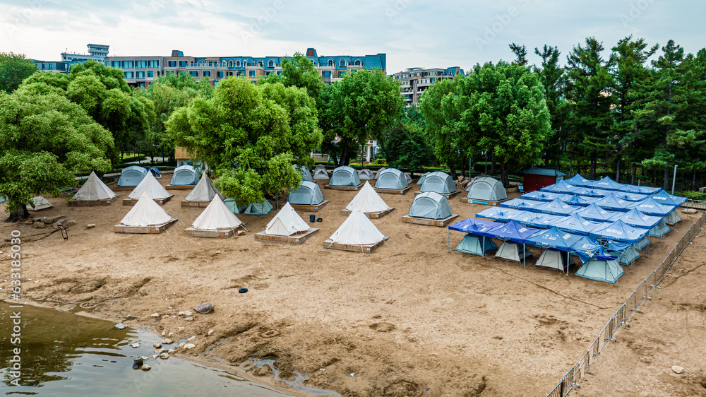 Lakes, beaches and tents - the scenery of Nanhu Park in Changchun, China in summer