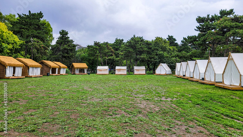 Tents in the campsite - Landscape of Nanhu Park, Changchun, China in summer © xiaowei