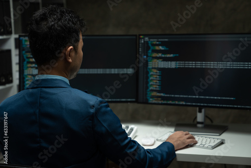 Wallpaper Mural IT programmer working on desktop computer Male expert innovating software engineer app development program check coding in bugging system. Torontodigital.ca