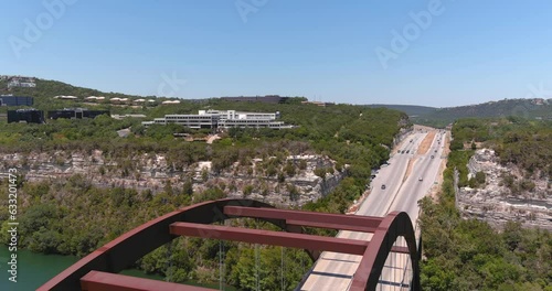 Moving backwards reveal drone shot of the Pennyback 360 bridge in Austin, Texas photo
