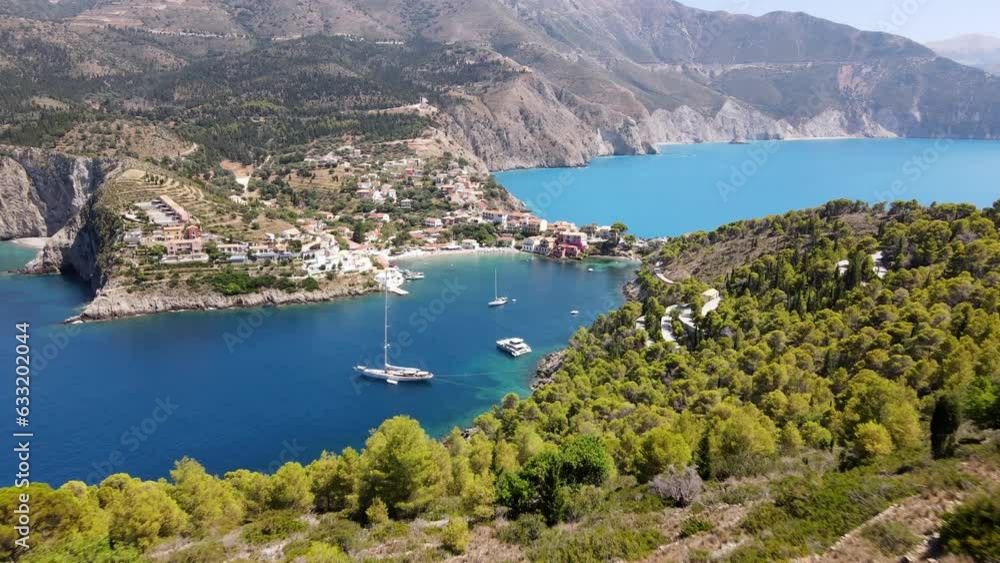 Big sailing yacht in the bay of Asos, Greece, aerial forward, beautiful nature Big sailing yacht in the bay of Asos, Greece, aerial forward, beautiful nature