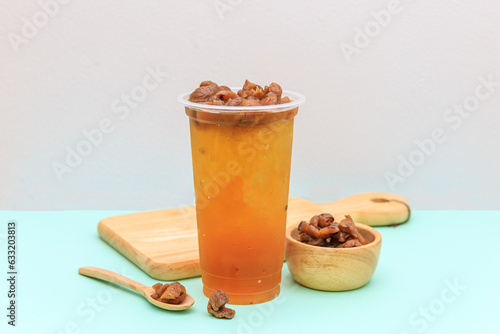 Sweet longan cold drink juice with ice in glass isolated on background