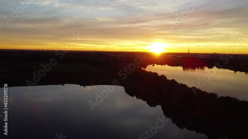 Pan over the silhouetted horizon of Mechels Broek from a drone. photo