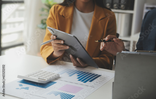 Business accounting concept, Business Man using calculator with computer laptop,pen, budget and loan paper in office.