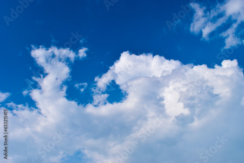 beautiful blue sky and white fluffy group of clouds with sunrise in the morning  natural background