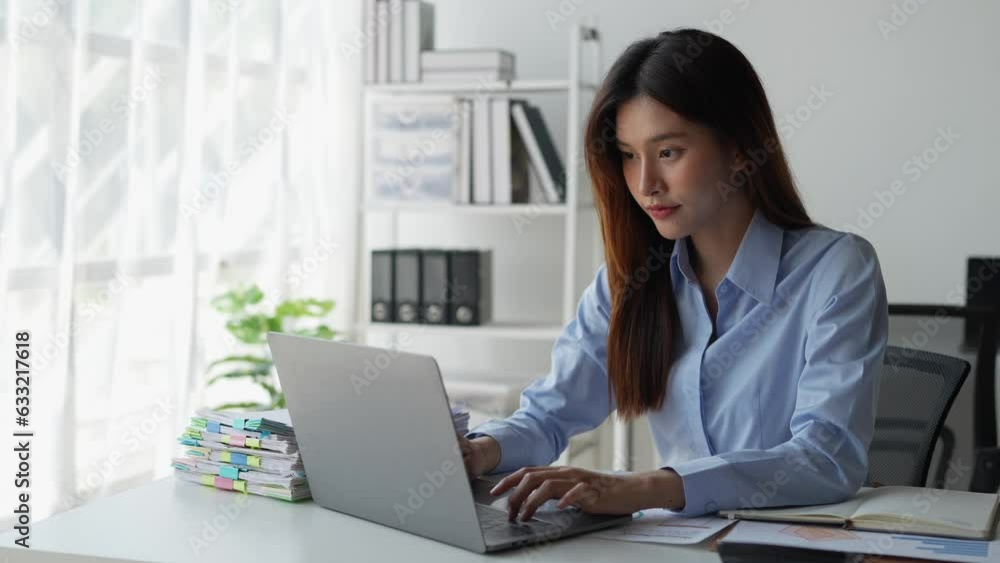 Happy young asian businesswoman using laptop computer to contact, chat, communicate, search, report, document business information to client, foreign investor. online business ideas. Happy young asian businesswoman using laptop computer to contact, chat, communicate, search, report, document business information to client, foreign investor. online business ideas.