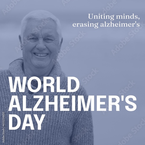 Composite of world alzheimer's day text over happy senior caucasian man by seaside